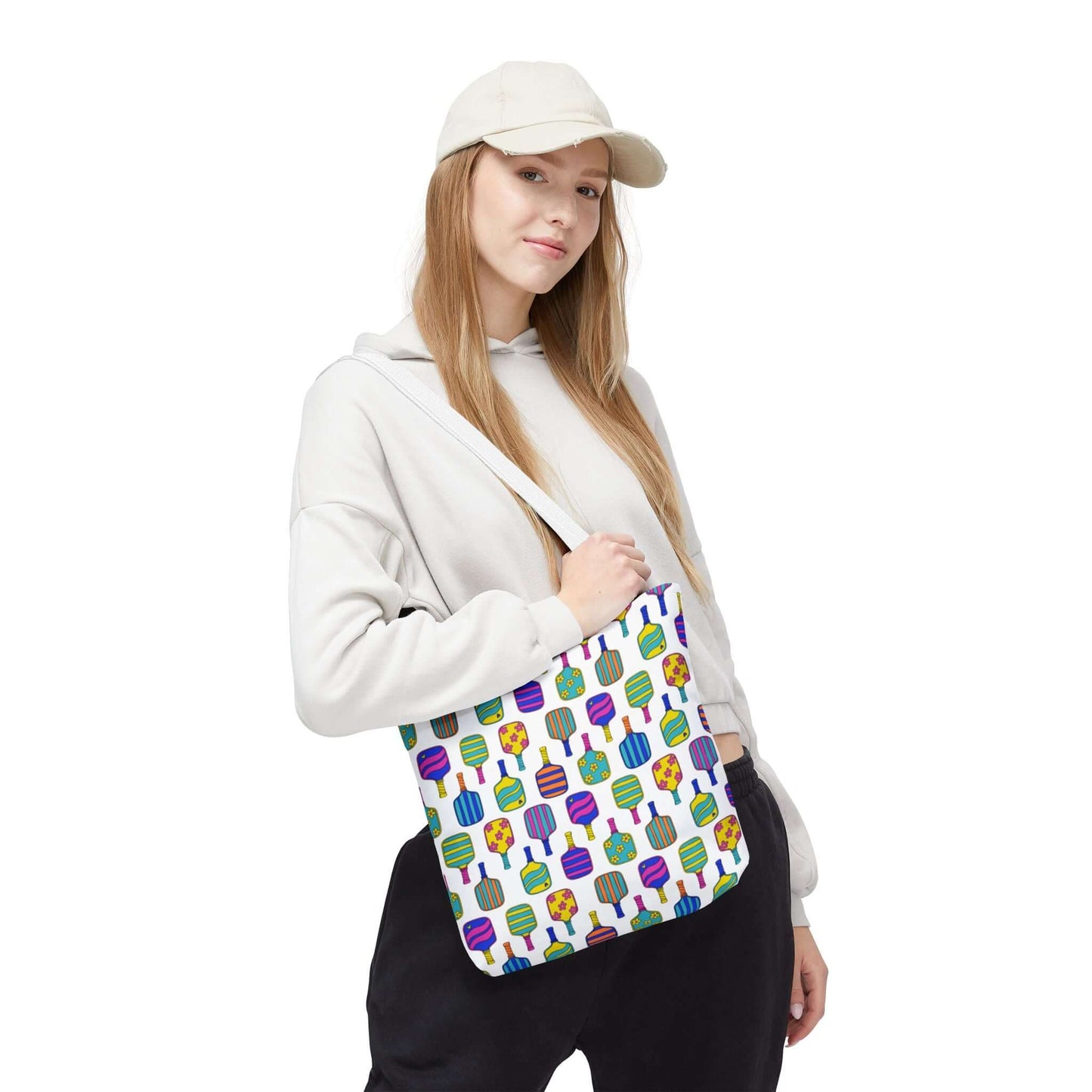 white tote bag with colorful pattern full of the best pickleball paddles