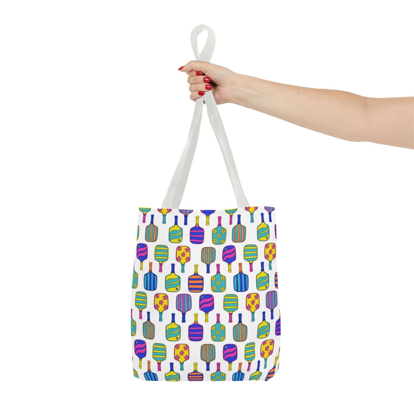 white tote bag with colorful pattern full of the best pickleball paddles