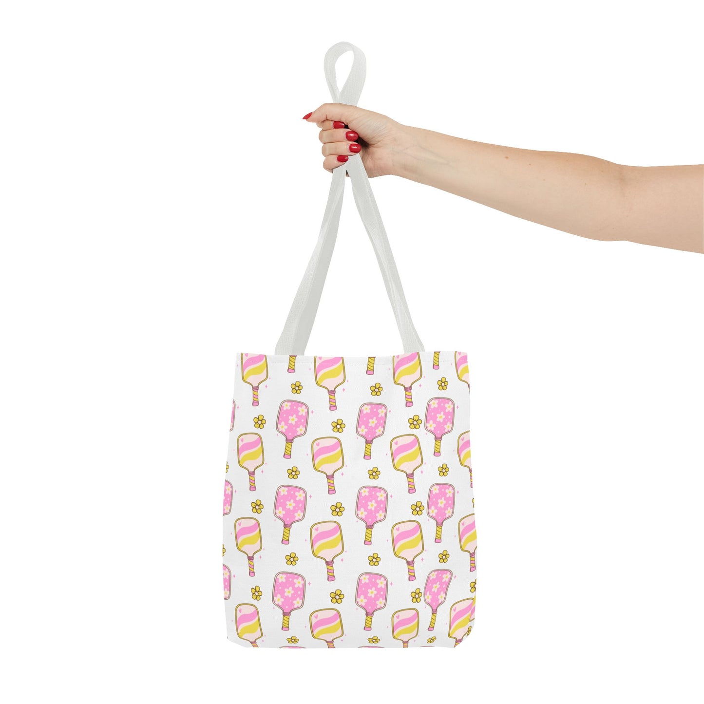 white polyester tote bag with pattern of light pink and yellow pickleball paddles