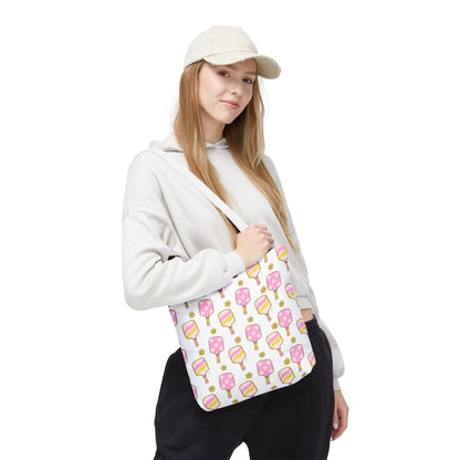 white polyester tote bag with pattern of light pink and yellow pickleball paddles