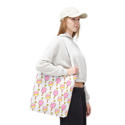 white polyester tote bag with pattern of light pink and yellow pickleball paddles