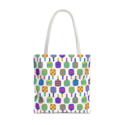 white tote bag with colorful pattern full of the best pickleball paddles