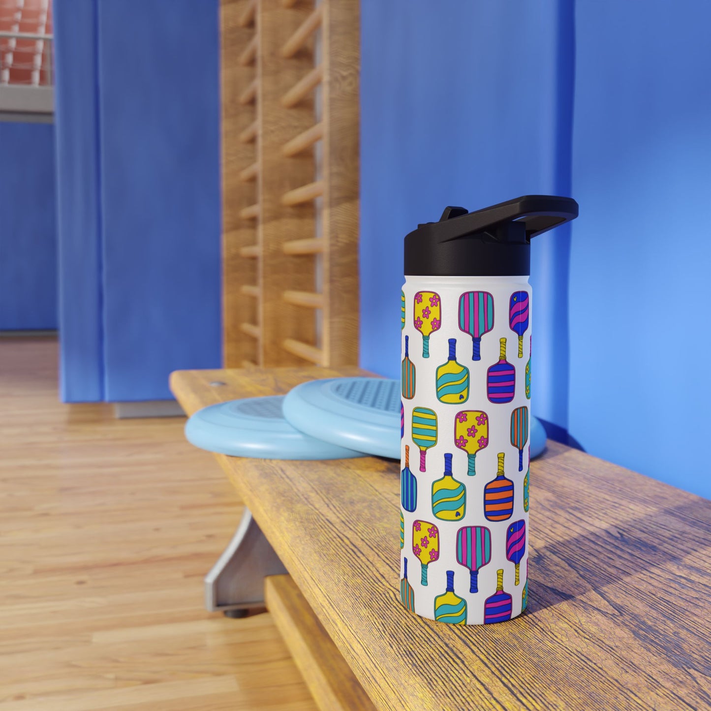 White stainless steel waterbottle with flip top patterned with bright colorful pickleball patterns