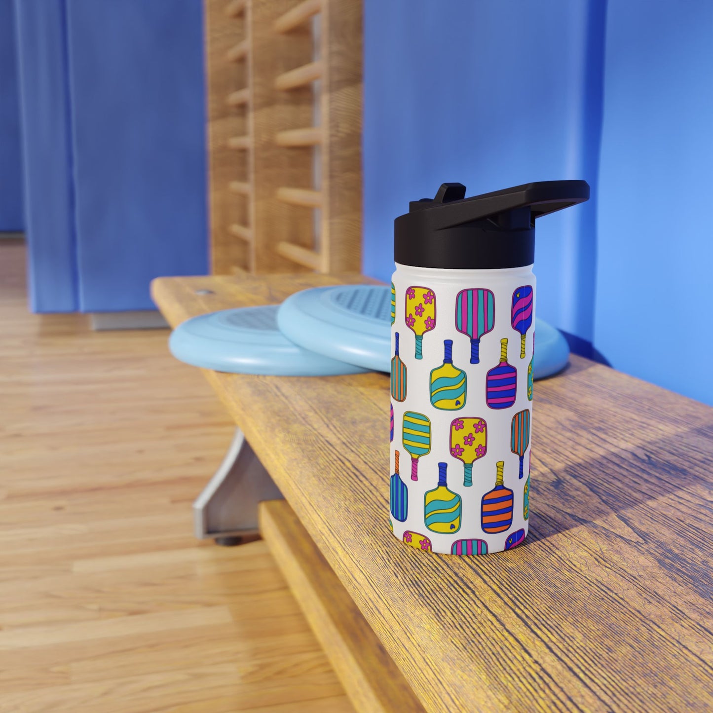 White stainless steel waterbottle with flip top patterned with bright colorful pickleball patterns