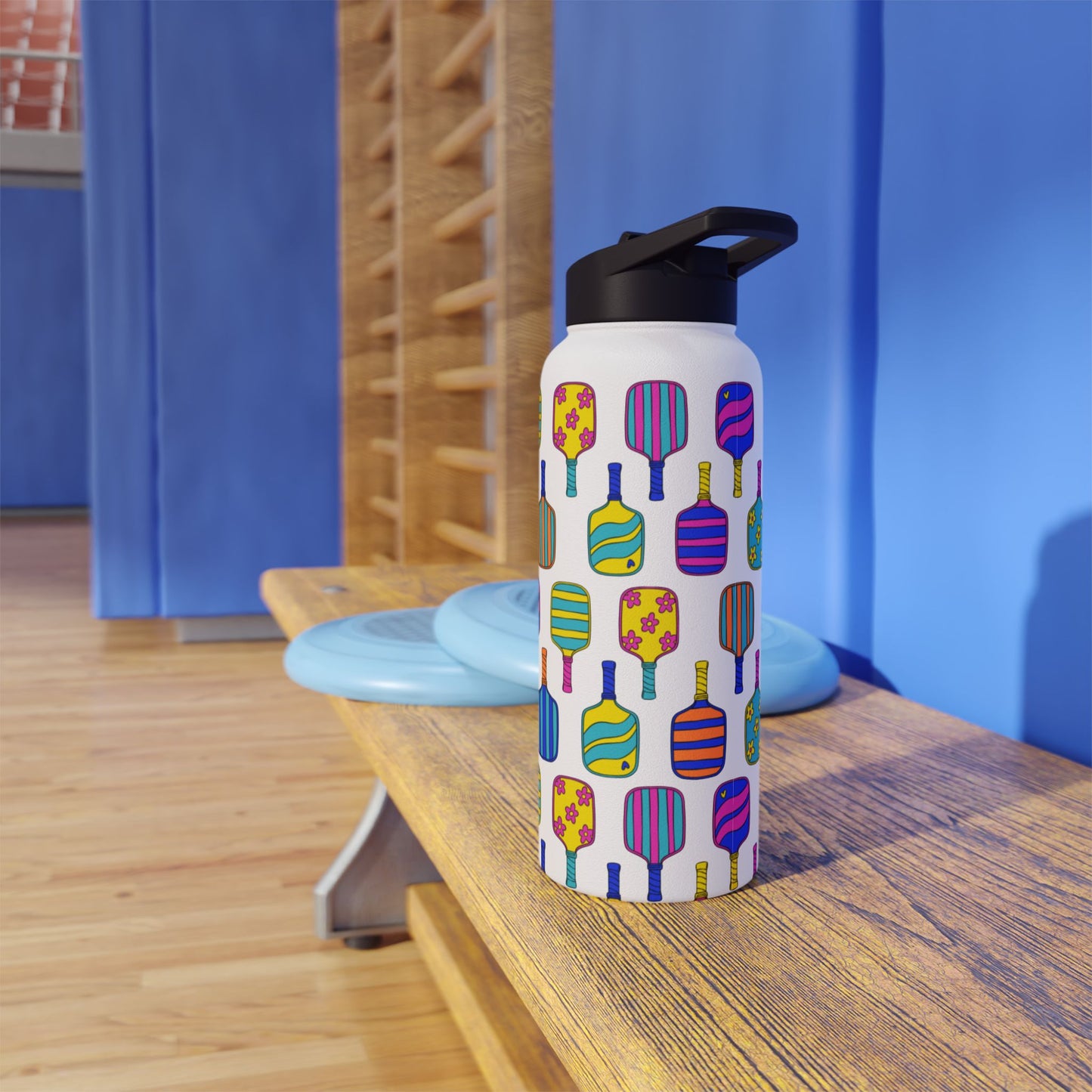 White stainless steel waterbottle with flip top patterned with bright colorful pickleball patterns