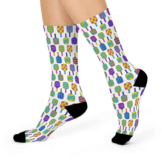 white calf length crew socks with colorful pickleball pattern filling the socks